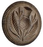 *SOLD* K58 19th century chip-carved butter print stamp of Pennsylvania origin boasting a deeply carved Thistle and Leaves design. There are small age cracks to the surface from wood shrinkage.  Very dry, natural patina surface. Carved from a single piece of wood. Measurements: 4 3/8 x 4 1/4" diameter (slightly out of round) x 3 tall.     