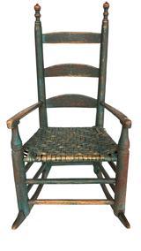 RM1122 Sensational 18th Century New England Childs Rocking Chair in wonderful original green paint. Rocker features original woven seat and the detailed arms and steam-curved slats are all wooden peg construction. There is spectacular wear to the backs of the intricately turned finials