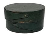 **SOLD** K195d Miniature round finger lapped pantry box with original Windsor green painted surface. The body and lid are wooden pegged steamed and bentwood construction, with the opposing finger laps being secured with tiny tacks.   Measurements: 2 ¾ diameter x 1 ½ tall. 