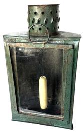 **SOLD** K197 19th century green painted half-round shaped tin and glass Hunting / Barn lantern featuring a prominent wavy and bubbled glass front panel that raises easily for access to the interior candle socket. The top features a round punched/pierced tin chimney/hood to both add airflow, and to protect the internal candle flame from wind/rain. A sturdy shaped tin handle with rolled edges remains intact on the back for carrying purposes. Lantern retains its original green painted surface and is in great working condition. (Candle not included). Approximate measurements:  7 ½ wide x 6 ¾ deep (at handle) x 12 ¾ tall.  