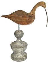 K1714 Hand carved wooden Curlew Shore Bird with long, curved bill. Carver unknown. Decoy has tack eyes and metal bill. It is solid wood with scarce remnants of original paint in some areas and has been mounted on a decorative wooden base for display purposes. Measurements: 13 ½ long x ~5/8 thick x 17 ½ tall (mounted height). 