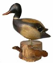 G519 Early 20th century beautifully carved miniature mallard drake in original paint and excellent condition. Mounted on a piece of wood. Probably 1930 -1940.Signed on bottom Mallard RG Cape Cod.