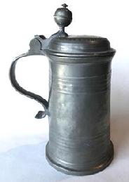 RM1071 Wonderful Pewter Tankard marked J. N. 1875 on the lid. There is also an embossed pattern creating a ring that encircles the scrolled initials and date on the lid. Inside on the bottom of the Tankard, there are two engraved rings encompassing a fairly prominent touch mark.