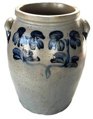 **SOLD** K1799 19th century signed Peter Hermann 3-gallon heavily Cobalt Blue Decorated Stoneware Crock stamped P HERMANN 3 G just below top rim and adorned with large hand brushed double flowers on each side. Tall, cylindrical form with flat bottom, tooled shoulder, flared rim, and applied lug handles with cobalt accents. Inscribed 3 and part of rmann is visible beside handle, just below the rim, on one side. (NOTE: Peter Hermann (1825-1901) ran his pottery on Edgar Street in Baltimore from 1850-1872.)  Measurements: 8 ½ diameter base x 14 ¼ tall.    