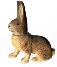 J50 Easter Candy Container - Flocked Rabbit in crouched position with right paw stretched forward. Circa 1940 Brown color, flocked surface,