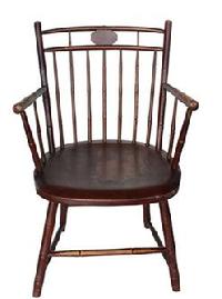 B585  "BIRDCAGE" WINDSOR ARMCHAIR. Early 19th century, mixed woods. Bamboo-turned, with a medallion crest and the original paint