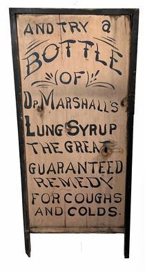 H1027 Early 20th century single sided advertising trade sign reading: And Try A Bottle Of Op. Marshalls Lung Syrup  - The Great Guaranteed Remedy For Coughs And Colds Nice, dry painted surface with applied molding around three sides that extends beyond the sides to create legs. Measurements: 19 wide x 1 3/8 thick x 43 tall.