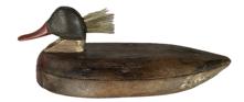 K1830 Hoopers Island Merganser Duck Decoy. Carver unknown. Original weight and staple intact on bottom. Amazing piece of Folk Art! Approximate measurements: ~12 ½ long x ~6 ¼ wide x ~5 tall.  