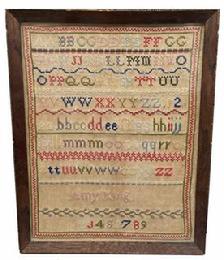 G572 Late 18th century early 19th century Sampler identified as being wrought by Amy King, undated. This simplistic work includes two sets of double alphabets