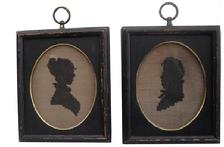 V356 19th century two small framed silhouettes that are needlepoint, This framed needlework is done in black thread on linen The square wooden frames are painted black and have a gold metal band on the inside rim. 5 1/2" x 6 1/2"