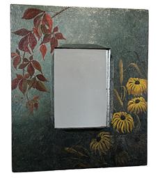 J452 Late 19th century New England wooden framed mirror featuring hand painted Black-Eyed Susan flowers and a branch containing fall-colored leaves on a blue painted and textured background. Mortised construction with small square head nails securing the wooden panel holding mirror in place on back. Circa 1870s-1900. Measurements: 11 1/2" wide x 3/4" thick x 13 1/4" tall