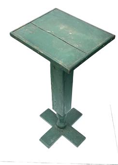 K1662 Tall pedestal / plant stand featuring a decorative column resting on crossed plank feet retaining old green painted surface. Applied rounded molding surrounds the tops edges. Circa 1900. Measurements: 15 ½ wide x 13 ¼ deep x 33 ½ tall.  