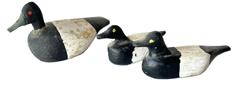 K1695A Group of 3 miniature decoys.  The smaller two have T carved into the bottoms and measure approximately 2 ¾  3 long x 1 ¼ tall. The larger decoy is signed Walter Lew? and dated (illegible) on bottom and measures approximately 3 ¾ long x 1 ½ wide x 2 tall.   