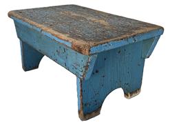 **SOLD** K1780 Pennsylvania original blue painted foot stool with one-board top and drop aprons that are mortised into the legs on each side. Legs boast half-moon cut out feet. This stool is very sturdy and tight. The wood is pine. Measurements: 18 long x 11 ½ wide x 9 tall.  