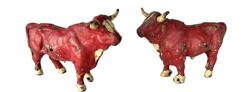 K130A Set of two Cast Iron Oxen bearing original red and white painted surfaces made by the Hubley Manufacturing Company of Lancaster, Pennsylvania. Circa early 1900s.  Approximate measurements: 6 ¾ long x 2 ½ wide x 4 ¼ tall. 