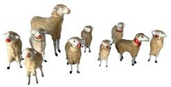 **SOLD** K78D Group of ten German Putz Sheep - each with painted eyes and dapple cloth covered composition bodies with freestanding wooden legs and painted hooves. Several of their collars are marked Germany.  They are all in very good condition with only minor wear on a few of the ears/noses. Largest to smallest, they stand between 3 ½ tall down to 2" tall.  