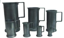 Y68 A set of 7 late 19th century  pewter measures. Graduated set up to a Litre size.  maker's marks