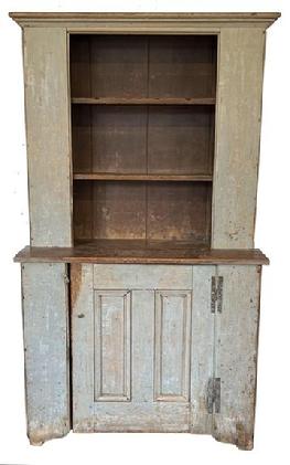 **SOLD** H408 18th century Country Stepback Cupboard original gray paint on the exterior and a dark red interior, circa 1780-1790 . The cupboard is One piece ,with open top and double paneled door in bottom with "H" hinges. Cut out feet, bead board back. Rose head and tee nail construction. The wood is pine, Cleaned down to the original gray with old dark ed paint on the inside.