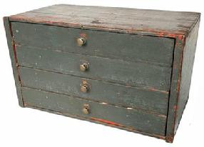 H1034 Late 19th century Pennsylvania stack of four drawers in old green over original pumpkin painted surface. Top drawer features divided interior. Measurements: 19 ½ wide x 11 deep x 11 tall.