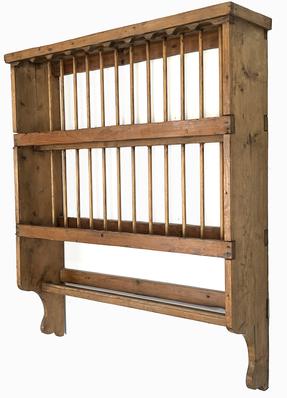 **SOLD** K1757 Mid-19th century hanging pine plate rack bearing natural surface.  Solid wood with mortised and square head nail construction. Circa 1850s. Measurements:  35 ¾ wide x 9 ¼ deep x 42 ½ tall.  