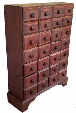 G118 19th century Pennsylvania red painted tall Apothecary Chest with twenty-eight drawers. The drawers are nailed construction and rest on an applied base with a nice high cutout apron. The drawer fronts are chamfered. The overlapping drawer fronts act as a drawer stop. Circa 1880    Measurements are: 31 ½ wide x 11 deep x 42 tall