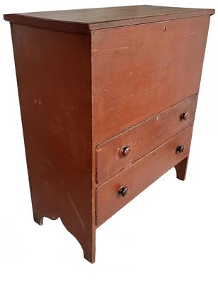 H1080 19th century New England original red painted mule chest featuring hinged lift lid storage area over two dovetailed drawers resting on tall cut out ends. Mortised battens on the underside ends of lid.  Square head nail construction. Natural patina interior. Two wide back boards measure 16" and 17" across. Found in a Massachusetts Estate.  Circa 1850  1860s. Measurements: 37 3/4" wide x 18" deep x 42 1/4" tall.