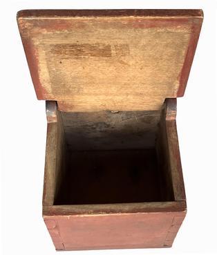 B637 Early 19th century Pennsylvania Salt Box/ Wall Box with the original red paint. Dovetailed case featuring an arched back with hole for hanging. The wood is walnut. Circa 1820.    Measurements: 12 1/4" tall x 8" wide x 7 1/2" deep