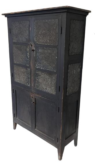 K96 19th century North Carolina original black painted Food Closet / Pie Safe with a total of 10 hand punched tins featuring pinwheels and hearts. The top two doors each feature three tins over two panel doors below and each end features two tins over a panel below. Basic applied molding surrounds the top. The case is fully mortised and pegged with square head nail construction and rests on raised feet. Tins are applied with small tacks with rounded heads. Circa 1840s  1860s. Very clean, natural patina interior. Measurements:  At top molding - 42 ½ wide x 16 ½ deep Case is 38 ½ wide x 14 ¾ deep. Overall height is 68 ¼ tall.   