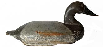 J329 Upper Susquehanna Flats Canvasback Hen decoy with original iron keel weight, leather rigging and a Pennsylvania Owner / Rig Tag intact on bottom. Decoy features a paddle-style tail with tack eyes. Unknown carver. Circa 1890  1910. 