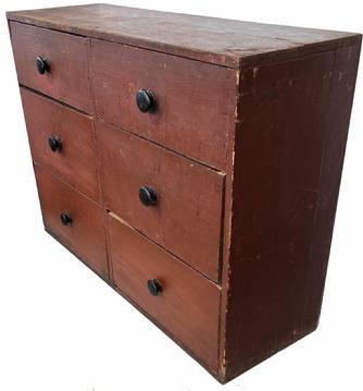 H384 Mid 19th century New England apothecary chest in original red paint with six drawers. Square head nail construction. Measurements: 42 wide x 14 deep x 31 tall. Each of the top two drawers are 8 tall, the four lower drawers are 10 tall.