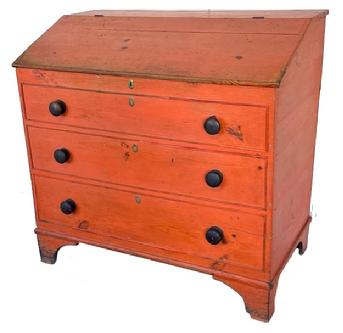 J347 Early 19th century New England grain bin boasting spectacular original Pumpkin painted surface. Bin features a lift lid with divided interior, three graduated faux drawers with molded edges on the front  and rests on tall cut out feet. Rosehead and square head nail construction. Circa 1800  1820s. Measurements: 39 ¾ wide x 22 ½ deep x 38 ¾ tall (back) x 32 tall (front)