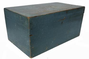 RM1451 Beautiful Massachusetts document box retaining original blue painted surface. Clean, natural patina interior features an open glove till and applied interior molding around the opening to help keep dust and moisture from seeping inside the box. T nail construction. Circa 1790  1810. Measurements: 20 wide x 12 deep x 9 ¾ tall.  