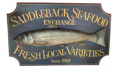 G728 Trade Sign advertising Saddleback Seafood Exchange Fresh Local Varieties Since 1919 with a large, high relief-carved and painted fish in the center featuring detailed fins, scales, tail, mouth, gills and eye. Scalloped, molded-border edges, and vibrant paint colors add to the overall appeal! This mid 20th century Trade Sign