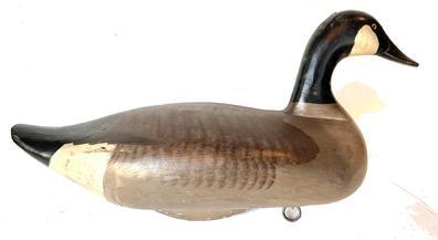 G571 Hand carved and painted R. Madison Mitchell Canada Goose Decoy, Circa 1966. Decoy retains its original weight and ring. Signed and dated on bottom.