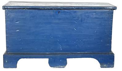 RM1449 19th century Eastern Shore, Maryland blanket chest in original dark blue painted surface. Original pencil sketches of ships inside lid. Dovetailed case with applied cut out bracket base featuring a third foot in the front. Dovetail and square head nail six-board construction. Lid retains batten ends with beaded edges. Natural patina interior with glove box. Chest is painted on all sides  making it a great option to use as a coffee table! Circa 1860s.  Measurements:  37¼ wide x 16 deep x 21¼ tall  