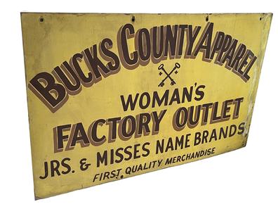 **SOLD** K1628 Double sided wooden Pennsylvania Trade Sign advertising "Bucks County Apparel Woman's Factory Outlet - Jrs. & Misses Name Brands - First Quality Merchandise". Both sides of the sign feature dark brown hand painted lettering with lighter brown shadowing on a mustard yellow painted background with various holes for hanging purposes.  Measurements:  48 wide x 30 tall x ½ thick.  