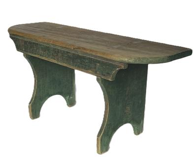 K1734 19th century wonderful Pennsylvania, original green painted bench featuring one-board top with nicely rounded ends and legs that are double mortised through the top with half-moon cut out feet. The front boasts a shaped drop apron with beaded edge that is mortised into the legs. Very sturdy bench with a great profile from all angles. The wood is pine. Mortised and square-head nail construction. Circa 1850  1860s. Measurements:  36 wide x 11 ¾ deep x 17 tall.  