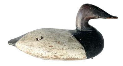 **SOLD** K128 Canvasback Drake Decoy by John Graham (1822-1912) of Charlestown, Maryland. Deeply branded P.K. BARNES on bottom. Retains nice, early working re-painted surface with evidence of being shot over. Original iron keel weight, staple and ring intact on bottom.    