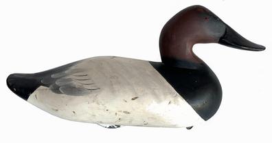  Canvasback Decoy carved by Charlie Speed Joiner (1921-2015) of Chestertown, MD. Original paint with wide bill, signed and dated 1965  retains original iron weight and ring on bottom.   Approximate measurements: 15 1/2" long x 6 3/4" wide x 8 1/4" tall