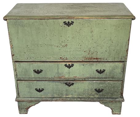 K236 Very early 19th century New England Chest over drawers / Mule Chest with two dovetailed drawers bearing original green painted surface. The lid has molded edge and is attached with snipe / cotter pin hinges. Pine, one board, T nail and rosehead nail construction resting on high cut out shaped feet. Clean, natural patina interior.  Circa 1800. Measurements: 42 ½ wide x 19 ½ deep x 39 ½ tall.  