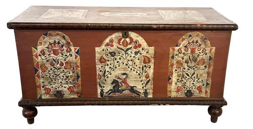 **SOLD** J434 18th century Lancaster County, Pennsylvania blanket chest with dovetailed case resting on turned feet. The paint decoration and absolutely spectacular artwork was added later. Identified on top of lid. Clean, natural patina interior with lidded glove till. Six-board construction with molded edge around the lid and applied molding around bottom. Measurements: 43 ½ wide x 18 ¾ deep x 22 tall. 