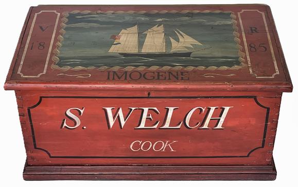 K1690 19th century Seamans chest in original red painted surface with wonderful hand painted artwork of the British flagged Ship Imogene on the lid, along with the initials V R and date 1885. (HMS Imogene of the Royal Navy launched June 24, 1831). The front panel bears the name S. WELCH with COOK painted below the name. Chest is dovetailed construction with applied molding around lid and base and strap hinges. Original iron handles remain intact on each end. Clean, natural patina interior boasts an open top till with drawer below.  Measurements: 41 ½ wide x 22 deep x 20 ½ tall.   