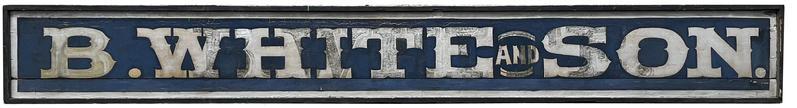 J137 Very early long wooden trade sign from eastern Pennsylvania  advertising B. WHITE and SON. Letters are painted in silver on a dark blue background. Sign boasts molded edge on all sides.  A separate framed photograph goes along with this sign  showing it as it was hung on the original storefront  and history reveals itself when viewing the reverse side of the sign as it bears the original B. WHITE sign as photographed and indicates the sign was added on to as the family grew to B. WHITE and SON. Sign measures 126 ½ long x 16 tall x 2 ¾ deep. Framed photograph measures: 16 wide x 14 tall x 1 thick