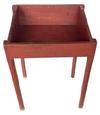 K32 Late 19th century Country Store display bin bearing old red painted surface. The bin has an open well area with tapered sides and rests on tall pencil post legs. Measurements: 23 &frac34;� wide x 20� deep x 32 &frac12;� tall (back) x 29 &frac14;� tall (front).  