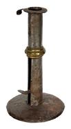 M117 Late 18th century Hog Scraper Wedding ring / band Candlestick with wide flat rim with finger curl at the top and working push-up tab bearing an illegible maker�s stamp. Sturdy sheet iron, hand forged construction with brass wedding band. Dark, natural surface. Circa 1790-1800. Measurements: 3 &frac12;� diameter base x 6 &frac14;� tall.