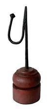 L236 Early 19th century hand forged iron tabletop rush light with counterweight arm to keep the rush grippers tight. Mounted in a turned wooden base with remnants of original red paint. Measurements: Base is 3 &frac14;� x 3 3/8� diameter x 3 5/8� tall. Overall height is 10 &frac14;� tall.  