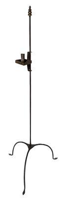 L162 Mid 18th Century hand forged wrought iron floor standing candlestand with brass finial and arched legs ending in arrow feet. This delicate candlestand boasts a single adjustable candle cup with a square drip pan. Approximate measurements: ~49 &frac12;� tall. ~19 &frac12;� across tips of feet. Candle socket is 2 1/8� tall and drop pan is ~3� square.  