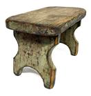 M257  19th century original blue painted Stool featuring a nice cut out design on each leg/end of the stool. The legs are double mortised through the top. Very sturdy. Circa 1840. The wood is white pine. Measurements: 12" long x 7" deep x 7 1/2" tall