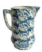 L333 19th century blue and white Spongeware pitcher boasting the classic sponge-applied blue semi-banded speckled pattern on durable stoneware.  A banded embossed/impression of double diamond patterns encircles the bulbous base. Handle and spout are in good condition. Small hairlines throughout, but do not affect the integrity of this piece.   Measurements: The footed base measures 4 &frac34;� diameter. Overall height is ~9� tall.  