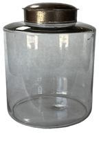 K232 Large, late 19th century Apothecary jar with tin lid. The jar is a hand-blown clear glass with remnants of the pontil on base. The glass is wavy with minor air bubbles and fine scratches in some places. Measurements:  8� diameter x 10� tall with lid.  